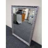 A contemporary silvered framed bevel edged overmantel mirror 86 cm x 112 cm