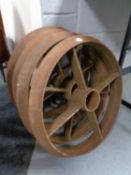 A set of four cast iron cart wheels