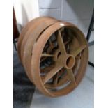 A set of four cast iron cart wheels