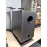 An Onkyo SKW-240 sub woofer together with two speaker stands