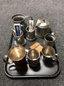 A tray of assorted antique and later pewter and plated wares to include tankards, lidded pot,