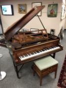 A mahogany cased baby grand piano by Loffler, width 141 cm,