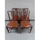 A set of four Edwardian Chippendale style dining chairs