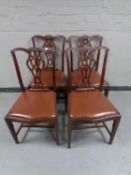 A set of four Edwardian Chippendale style dining chairs