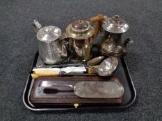 A tray containing three plated teapots together with a large silver plated serving spoon and ladle,