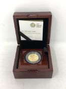 A Royal Mint 2020 1/4oz Britannia gold coin, in box with certificate.