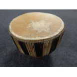 An African hide upholstered hand drum
