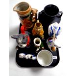 A tray containing assorted ceramics to include a nodding dog teapot, beer stein, character jugs,