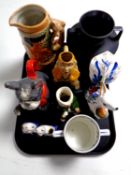 A tray containing assorted ceramics to include a nodding dog teapot, beer stein, character jugs,