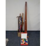 A box containing walking sticks, parasol, draftsman's rules,