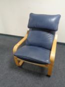 An Ikea beech framed blue leather armchair