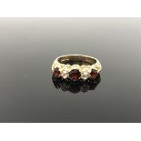 A 9ct gold garnet set ring, size P CONDITION REPORT: 3.