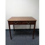 A 19th century mahogany side table fitted two drawers