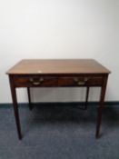 A 19th century mahogany side table fitted two drawers