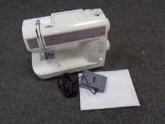 A Cooper electric sewing machine with foot pedal