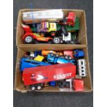 Two boxes containing a large quantity of plastic vehicles to include tankers, remote control buggy,