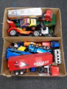 Two boxes containing a large quantity of plastic vehicles to include tankers, remote control buggy,