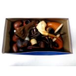 A box containing a collection of vintage pipes