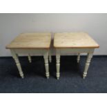 A pair of stripped pine square topped cafe tables on painted bases