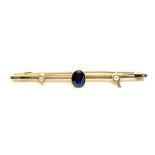 A 15ct gold brooch set with a sapphire, 2.9g.