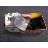A case and a box containing a large quantity of vinyl 7 inch singles to include The Jam,