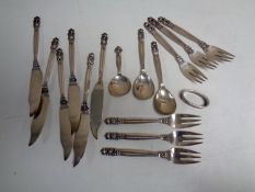 Fifteen pieces of Norwegian Georg Jensen silver cutlery together with a Georg Jensen silver napkin