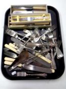 A tray containing a quantity of stainless steel and silver plated cutlery together with a silver