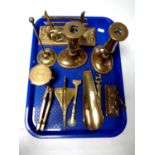 A tray containing assorted antique and later brass ware to include fox letter rack, candlestick,