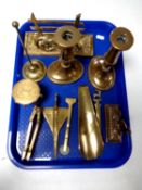 A tray containing assorted antique and later brass ware to include fox letter rack, candlestick,