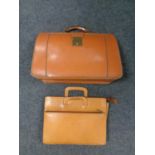 A vintage leather doctor's bag together with a leather briefcase
