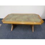 An octagonal tile topped refectory coffee table