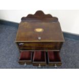 A reproduction Victorian style jewellery box fitted three drawers