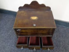 A reproduction Victorian style jewellery box fitted three drawers