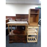 A pine kitchen trolley fitted a drawer together with a teak effect bedside stand,