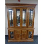 An American style four door display cabinet fitted cupboards beneath