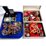 A tray containing a jewellery box containing a large quantity of assorted costume jewellery,