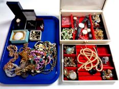 A tray containing a jewellery box containing a large quantity of assorted costume jewellery,