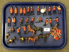 A tray of 20th century hand-painted die cast military figures including British troops in bearskins,