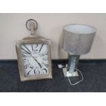 A contemporary mirrored table lamp with shade together with a retro style French wall clock