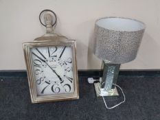 A contemporary mirrored table lamp with shade together with a retro style French wall clock