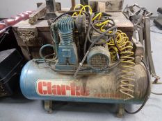 A Clarke industrial compressor with hose attachment