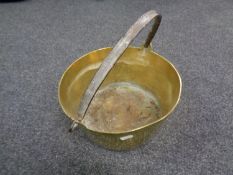 An antique brass cast iron handled jam pan