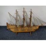 A hand built wooden model of a three masted galleon