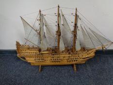 A hand built wooden model of a three masted galleon
