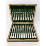 An Edwardian twelve piece EPNS fish cutlery set with faux mother of pearl handles,