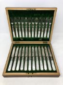 An Edwardian twelve piece EPNS fish cutlery set with faux mother of pearl handles,