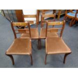 A set of four Reprodux brass inlaid dining chairs (brown seats)
