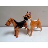 Two Royal Doulton figures of dogs,
