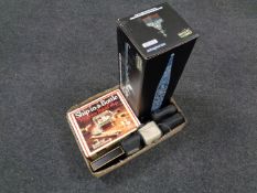A box containing assorted cameras, wine corkscrew set,