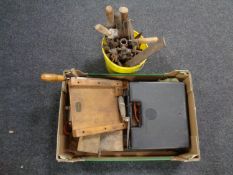 A bucket containing vintage hand tools together with a further box containing spirit level